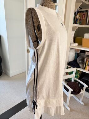 Sleeveless White athletic Dress with flirty side ties. NWOT